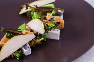 Pink gnocchi with a green core and ricotta cream